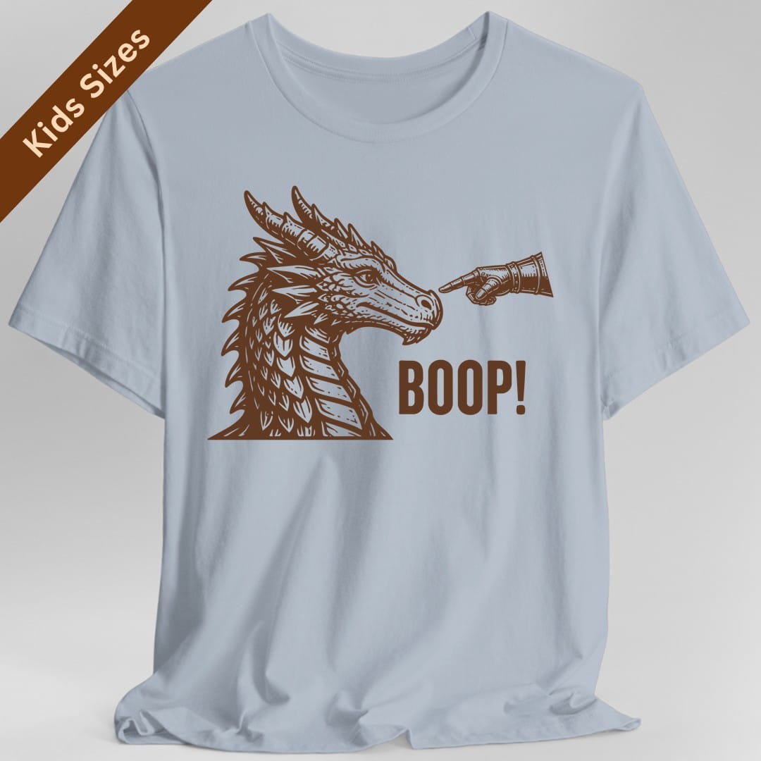 The same Dragon Boop design, on a light blue kids t-shirt.