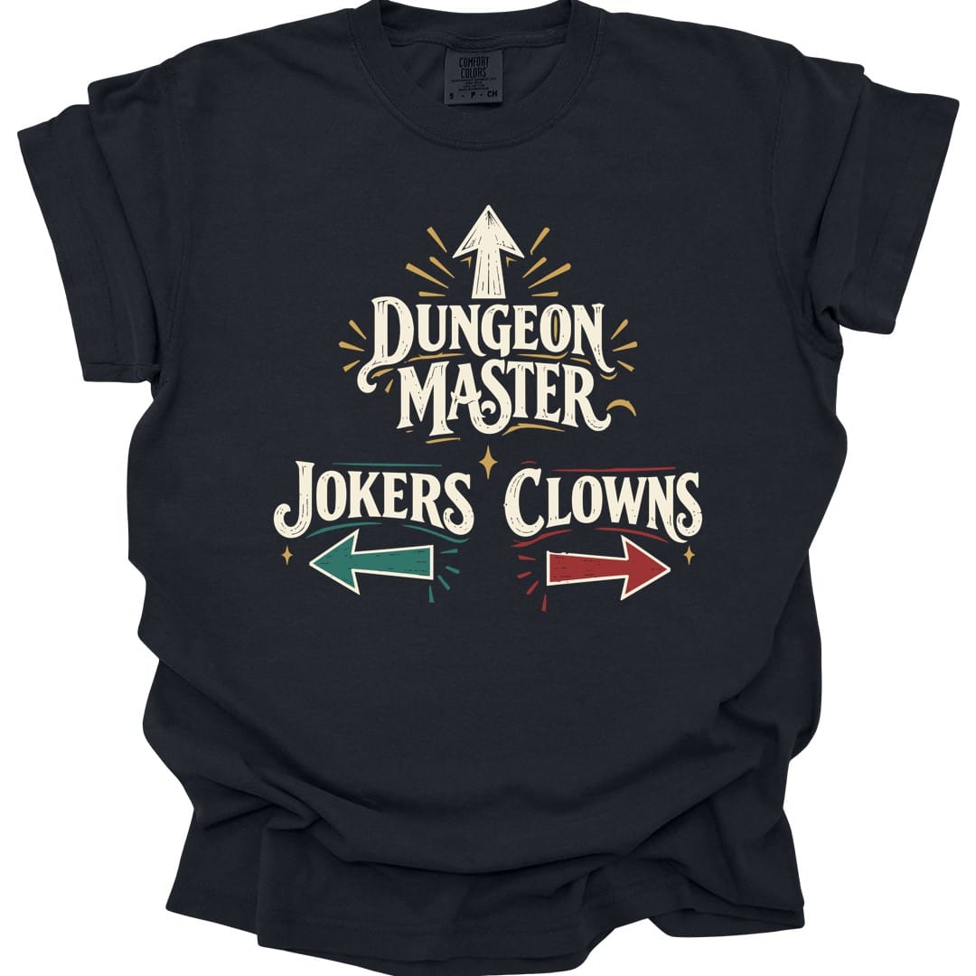Black t-shirt. The design reads "Dungeon Master" in large vintage circus lettering, with an arrow pointing straight up above it. Below, "Jokers" sits on the left with a teal arrow pointing left, and "Clowns" on the right with a red arrow pointing right. Small gold sparkles and radiating lines surround the words. Cream lettering with teal, red and gold accents in a retro sign style.