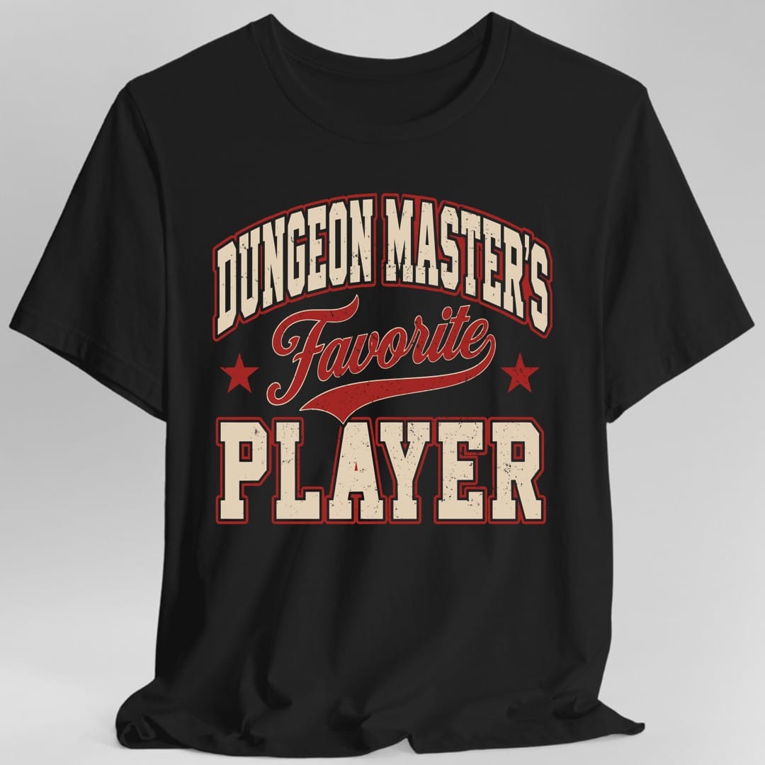 Black t-shirt. The design reads Dungeon Master's Favorite Player. Dungeon Master's is arched across the top in cream block capitals outlined in red, Favorite runs across the middle in red script with a swoosh underline and a small red star on each side, and Player fills the bottom in large cream varsity capitals outlined in red. Worn vintage screen print texture, no picture.