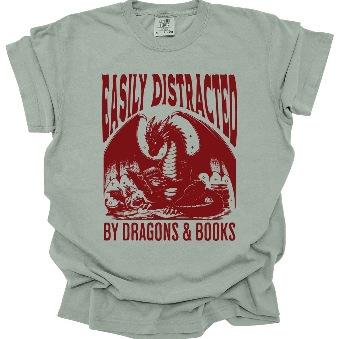 The same Easily Distracted by Dragons and Books design, on a bay t-shirt.