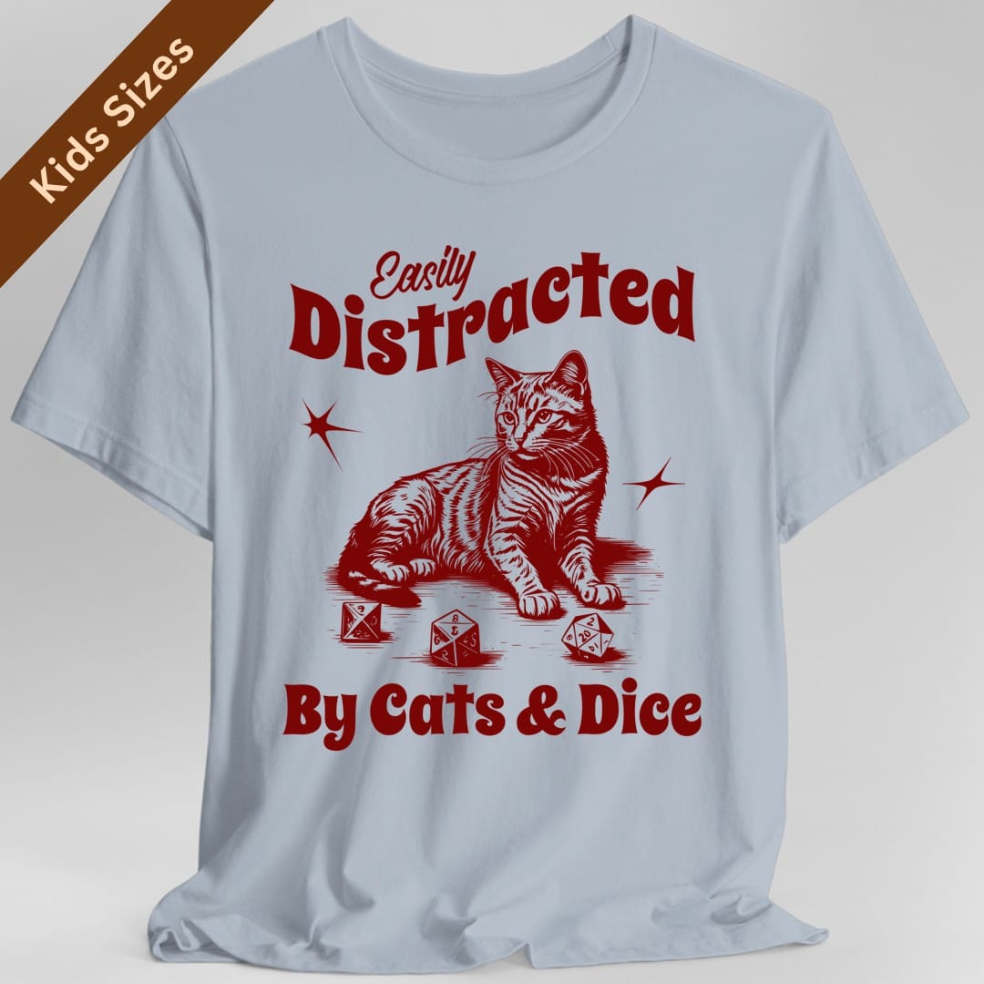 The same Easily Distracted By Cats and Dice design, on a light blue kids t-shirt.
