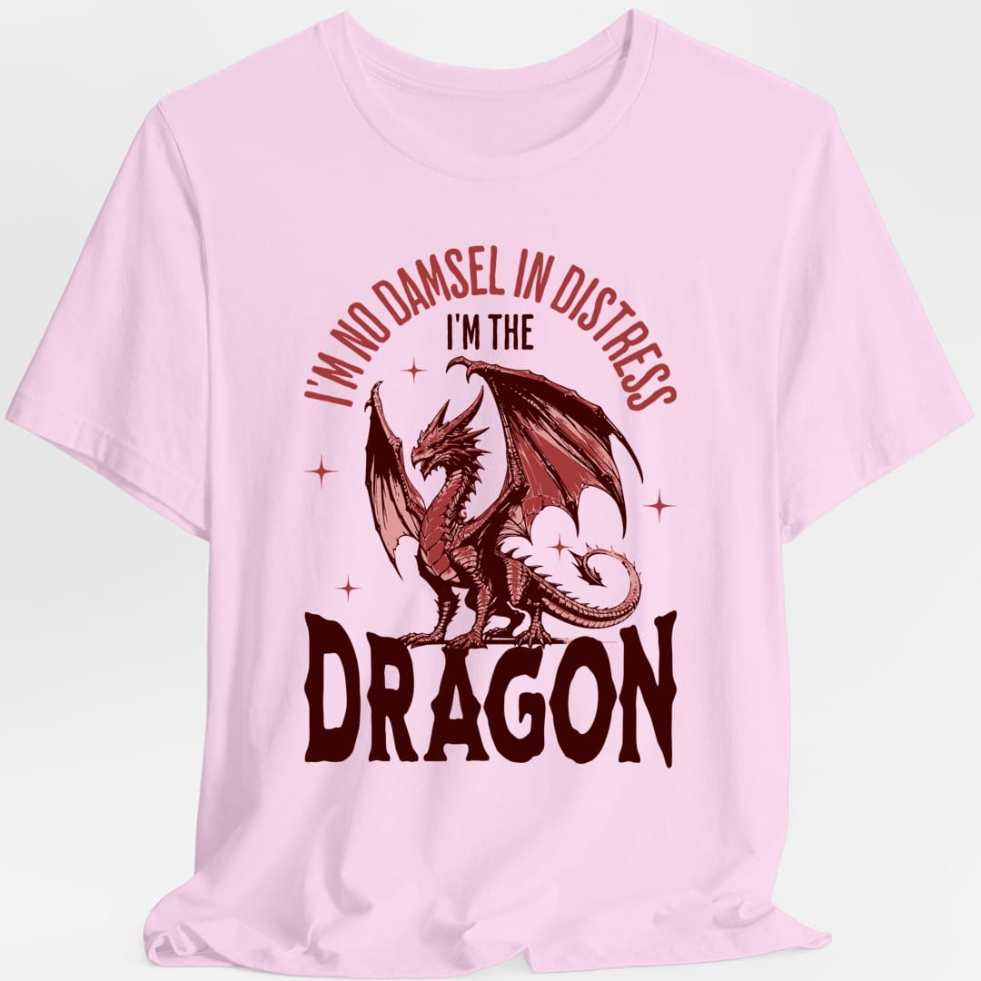 The same No Damsel In Distress dragon design, on a light pink t-shirt.