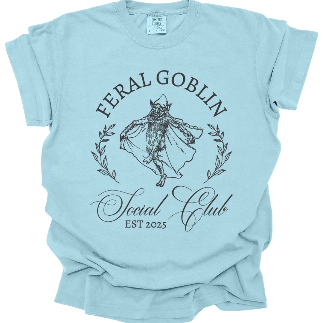 The same Feral Goblin Social Club, cat design, on a chambray t-shirt.