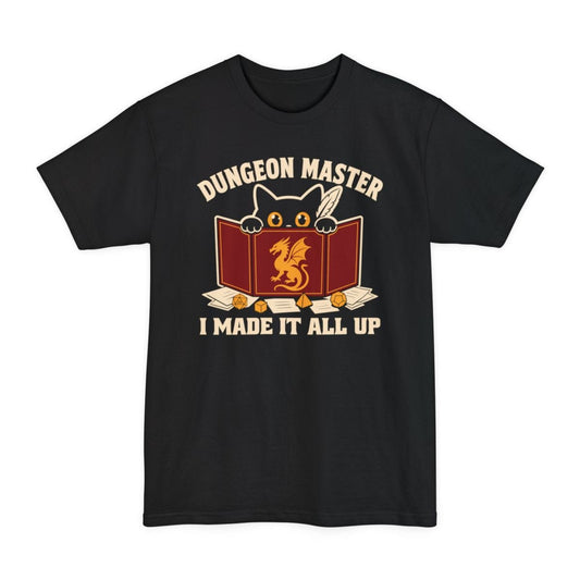 Black tall t-shirt. Reads "Dungeon Master" curving across the top in cream capitals. Below, a white cat peers over the top of a dark red dungeon master screen with a gold dragon printed on it, paws hooked over the edge, papers and dice scattered around. Across the bottom, "I made it all up".