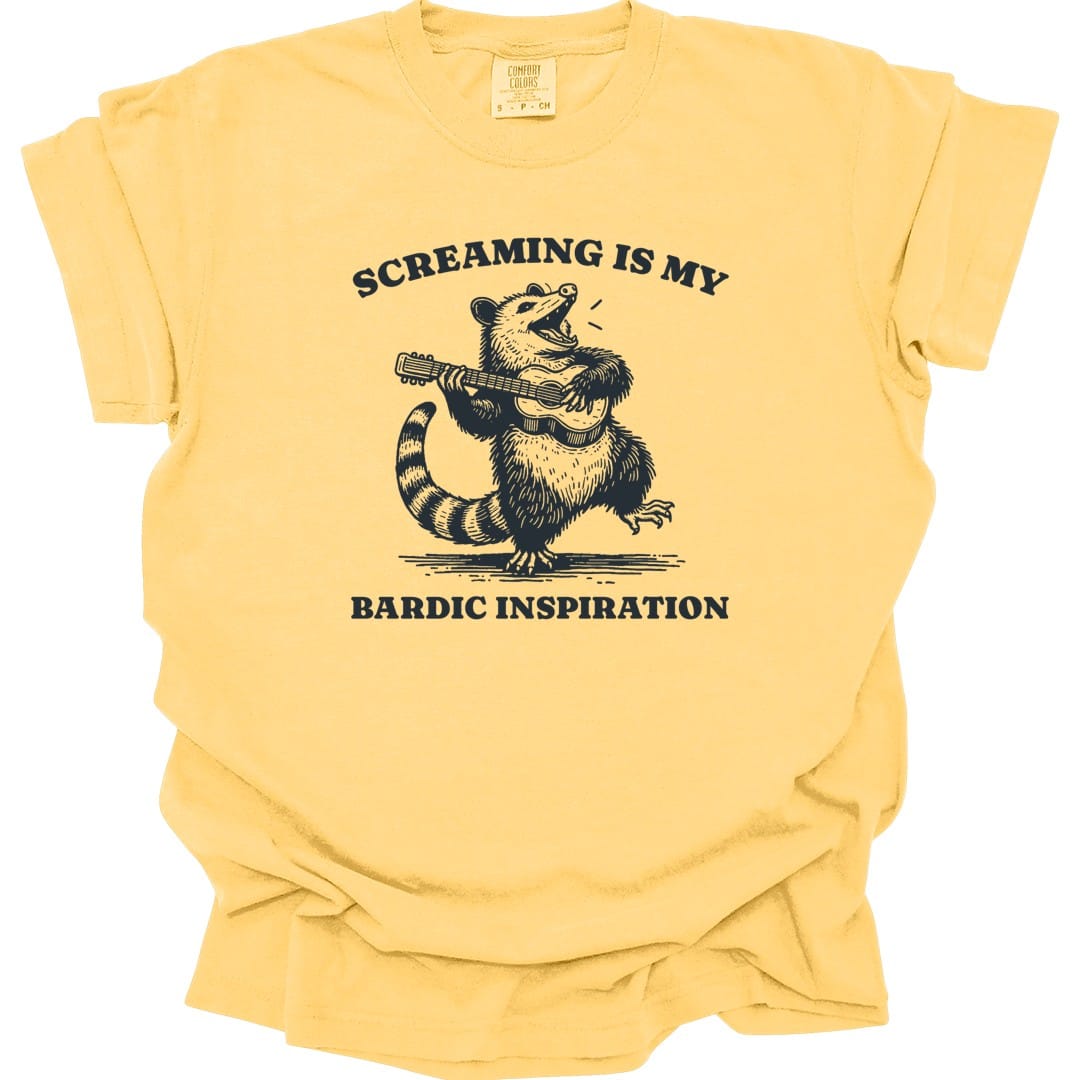 The same Bardic Inspiration possum design, on a butter t-shirt.