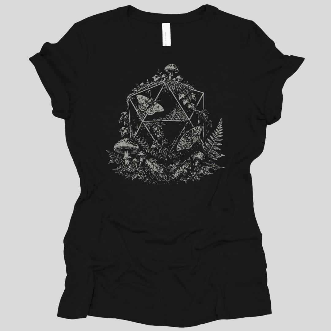 Black women's t-shirt. A twenty-sided die outline sits behind a large moth with spread wings, surrounded by toadstools, ferns and leaves. Everything is drawn in fine dotted stipple shading, all in a single pale cream. No words.