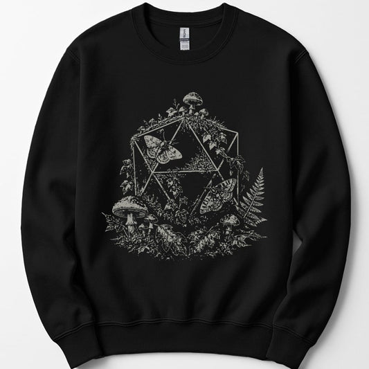 Black sweatshirt. A twenty-sided die outline sits behind a large moth with spread wings, surrounded by toadstools, ferns and leaves. Everything is drawn in fine dotted stipple shading, all in a single pale cream. No words.