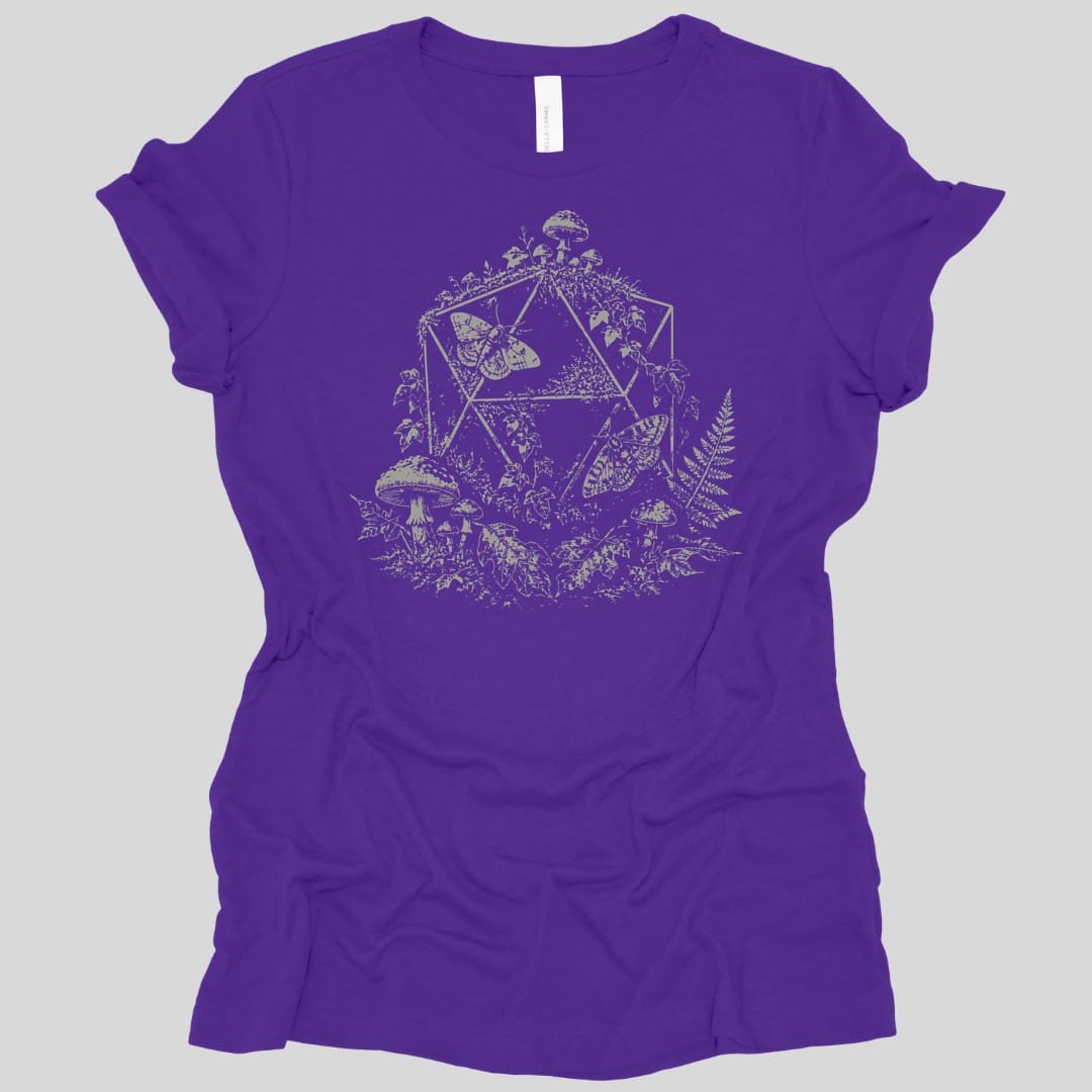 The same Goblincore D20 stipple design, on a team purple women's t-shirt.