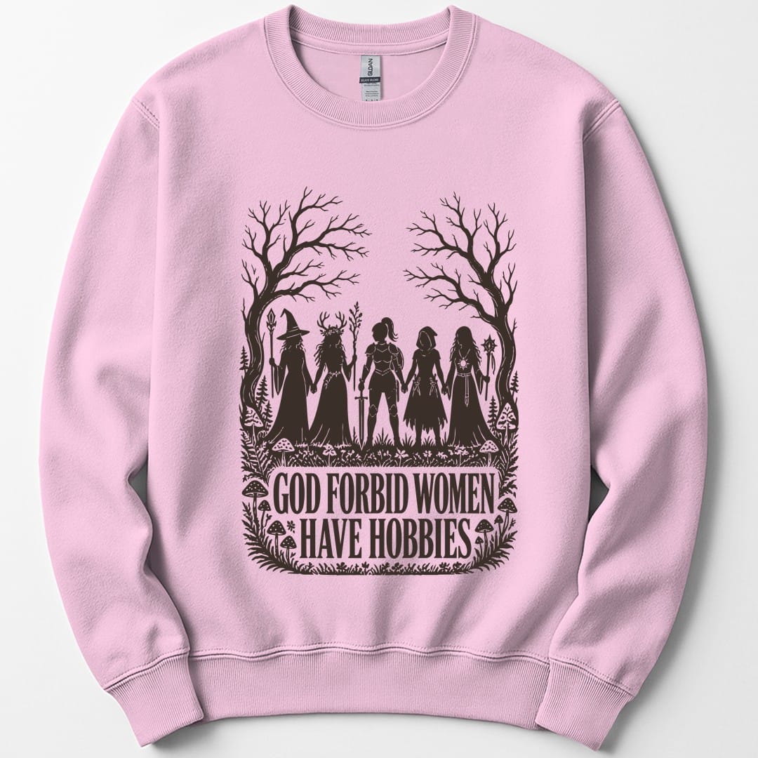 The same God Forbid Women Have Hobbies design, on a light pink sweatshirt.