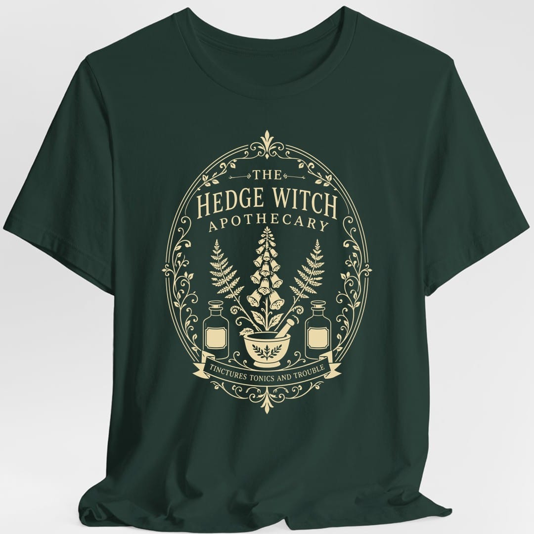 The same Hedge Witch Apothecary label design, on a forest green t-shirt.