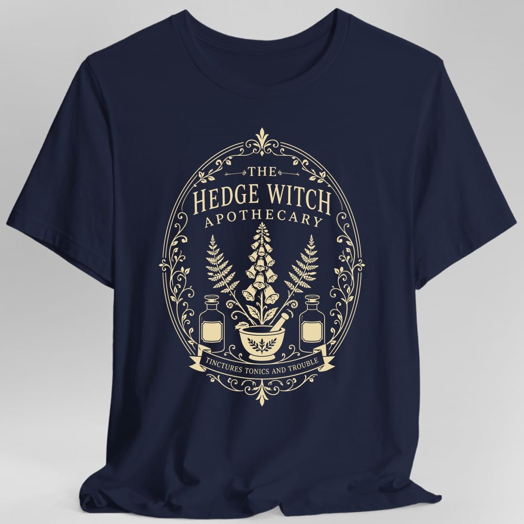 The same Hedge Witch Apothecary label design, on a navy t-shirt.