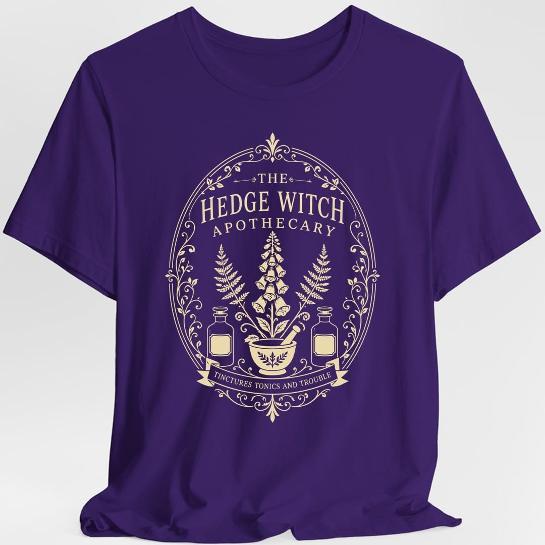 The same Hedge Witch Apothecary label design, on a purple t-shirt.
