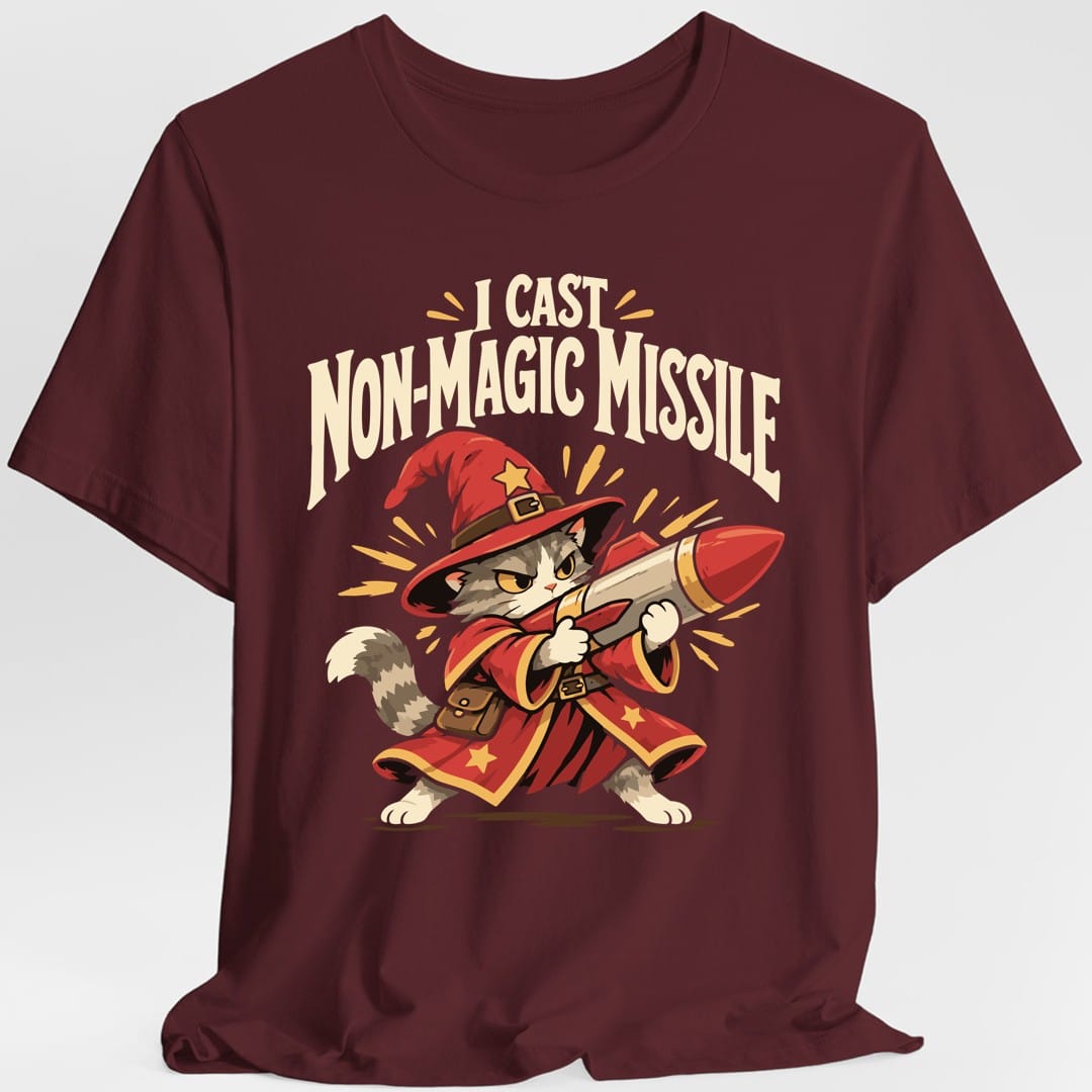 The same Non-Magic Missile wizard cat design, on a maroon t-shirt.