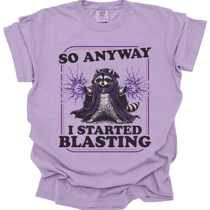 The same I Started Blasting raccoon design, on an orchid t-shirt.