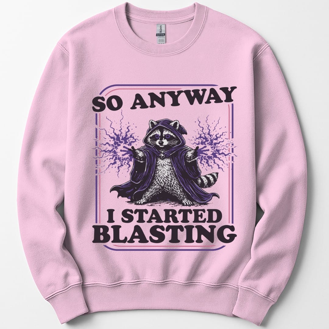 The same I Started Blasting raccoon design, on a light pink sweatshirt.