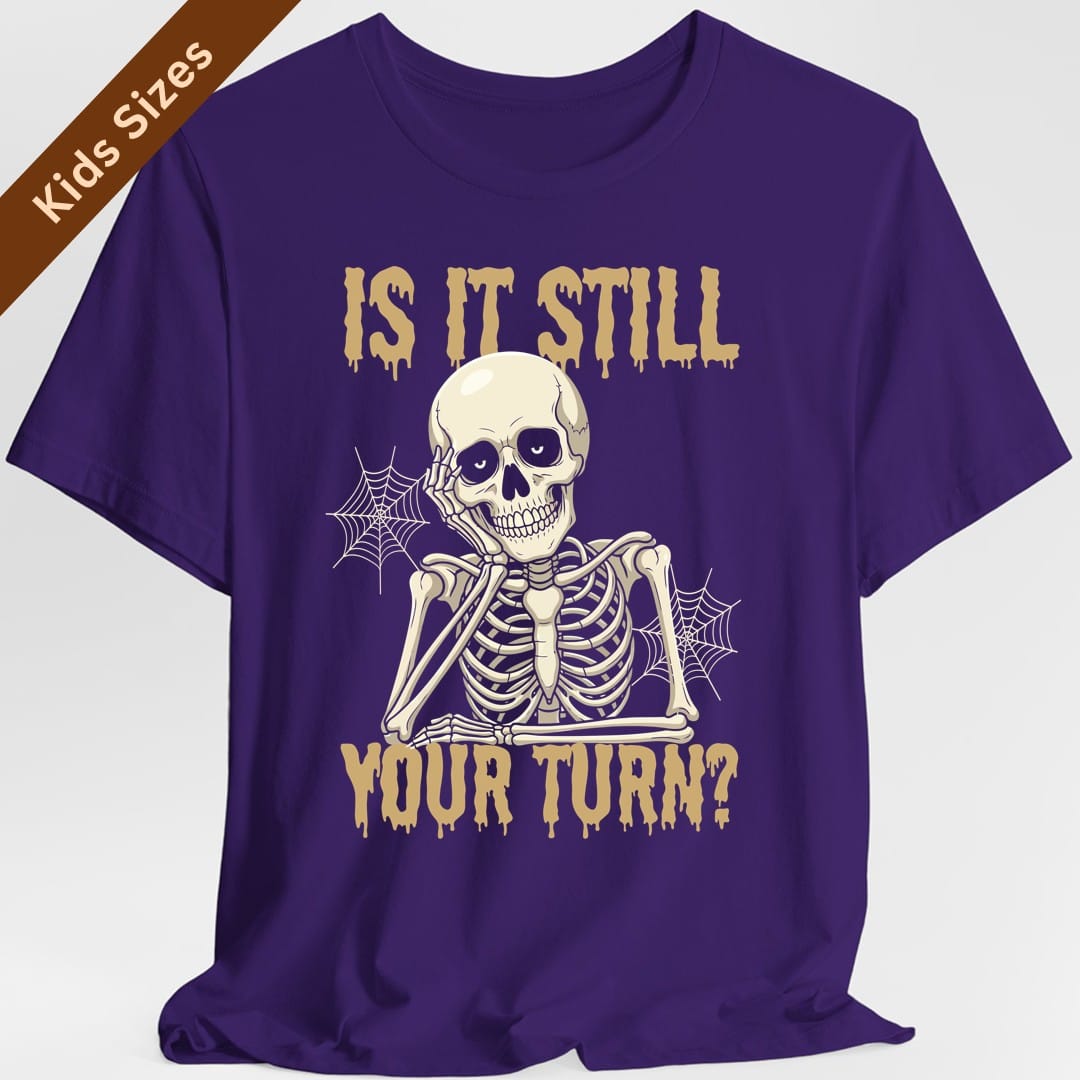 The same Is It Still Your Turn skeleton design, on a purple kids t-shirt.