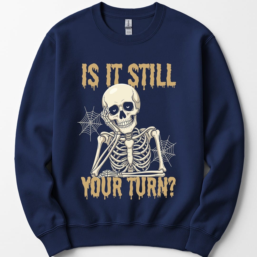 The same Is It Still Your Turn skeleton design, on a navy sweatshirt.