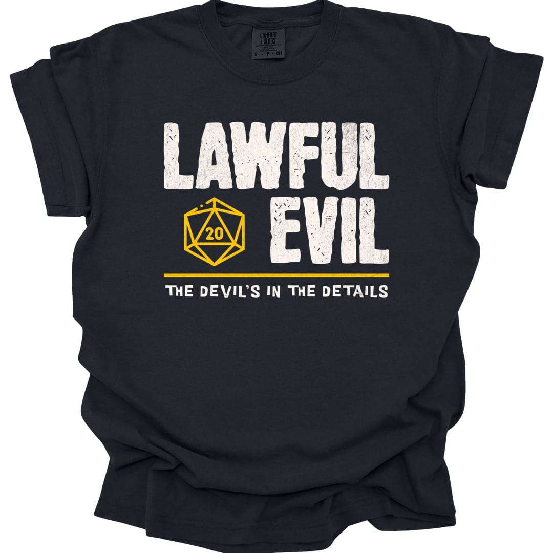 Black t-shirt. Reads "Lawful" then "Evil" in tall rough cream capitals stacked over two lines. A gold outlined twenty-sided die showing 20 is tucked to the left of the word "Evil". A gold rule runs underneath, and below that a smaller cream line reads "The devil's in the details." All type, no illustration.