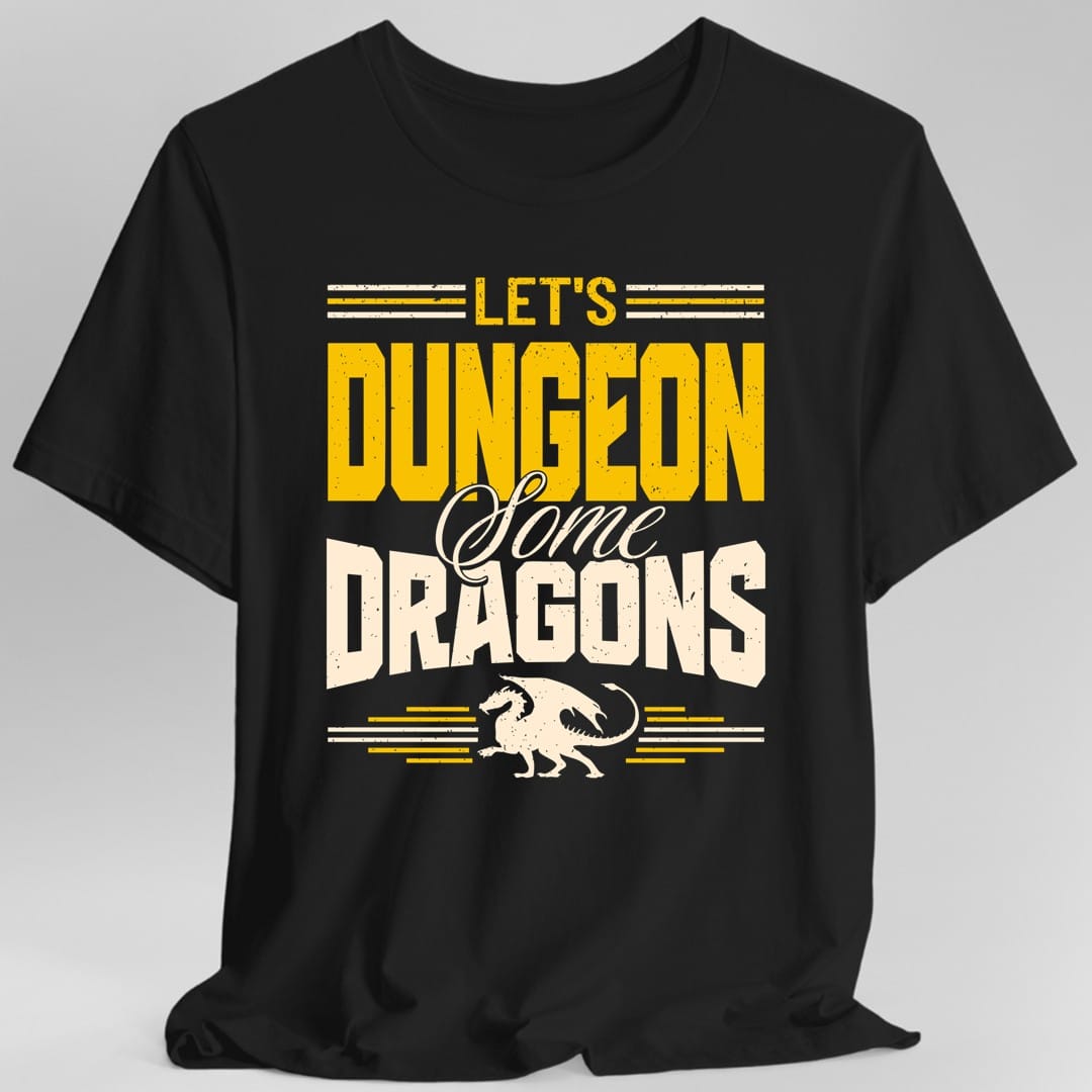 Black t-shirt. Reads "Let's" in gold, "Dungeon" in large gold capitals, "Some" in cream script and "Dragons" in large cream capitals, stacked over four lines. A small gold dragon walks along the bottom with speed lines either side of it, and more lines run above the top word.