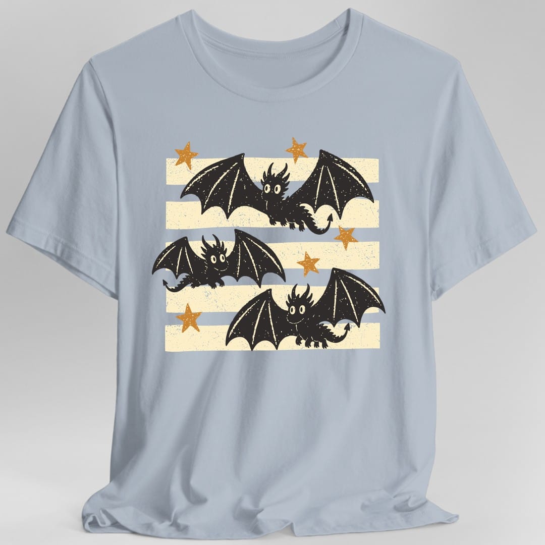 The same Little Dragons design, on a light blue t-shirt.