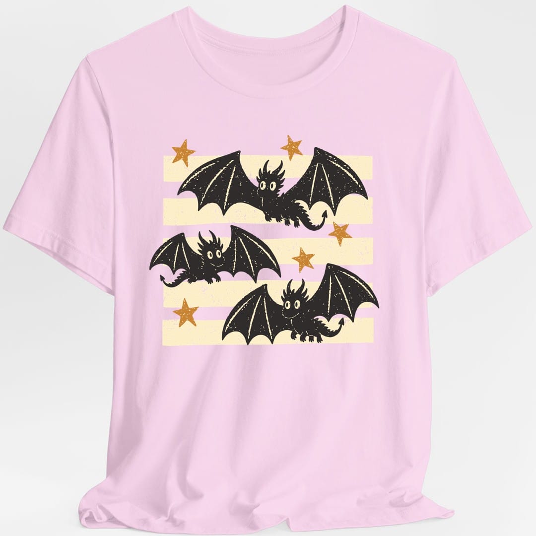The same Little Dragons design, on a light pink t-shirt.