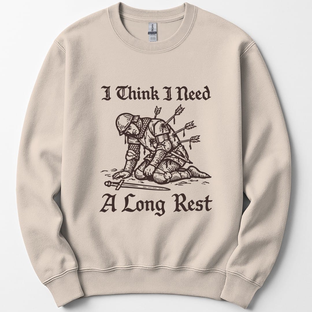 The same Long Rest knight design, on a sand sweatshirt.