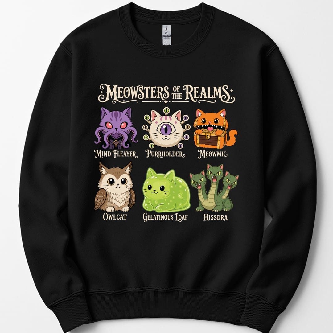 Black sweatshirt. Reads "Meowsters of the Realms" across the top in an ornate banner. Below, six cat versions of D&D monsters in two rows, each labeled: Mind Fleayer, Purrholder, Meowmic, Owlcat, Gelatinous Loaf and Hissdra. Bright cartoon style in purple, orange, green and cream.