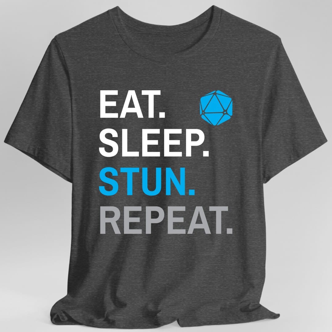 The same Monk Eat Sleep Stun design, on a dark heather t-shirt.
