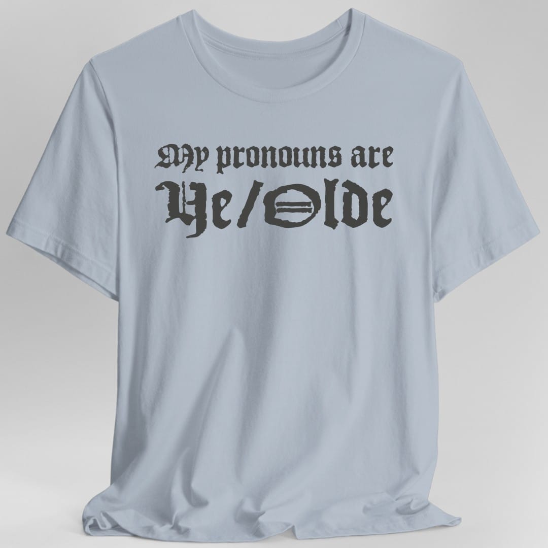 The same My Pronouns Are Ye Olde design, on a light blue t-shirt.