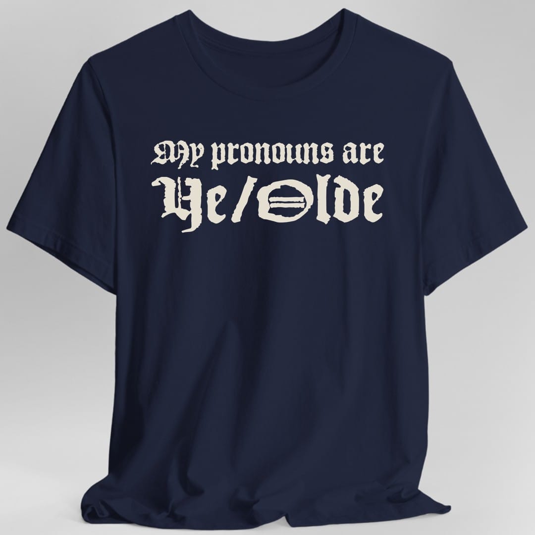 The same My Pronouns Are Ye Olde design, on a navy t-shirt.