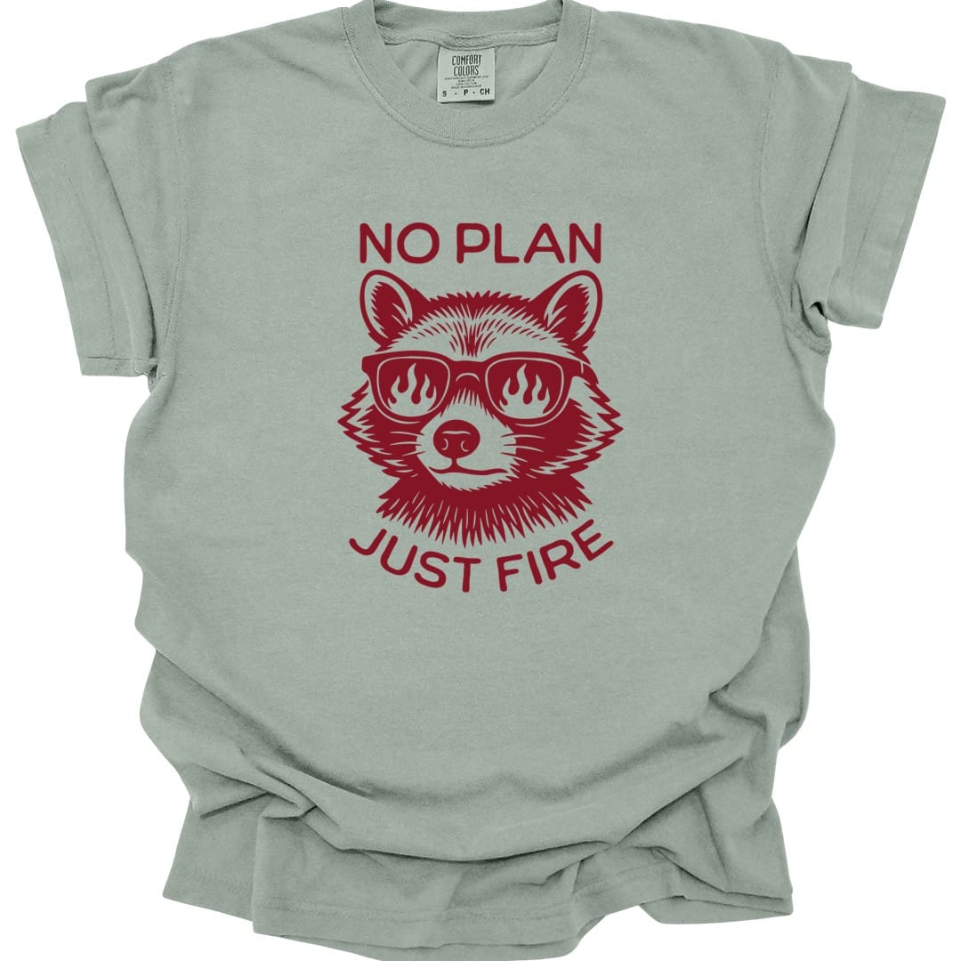 The same No Plan Just Fire raccoon design, on a bay t-shirt.