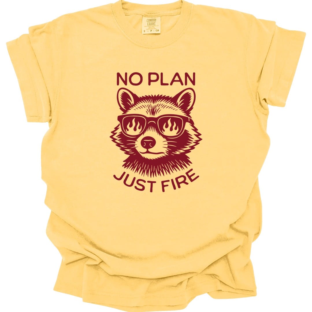 The same No Plan Just Fire raccoon design, on a butter t-shirt.