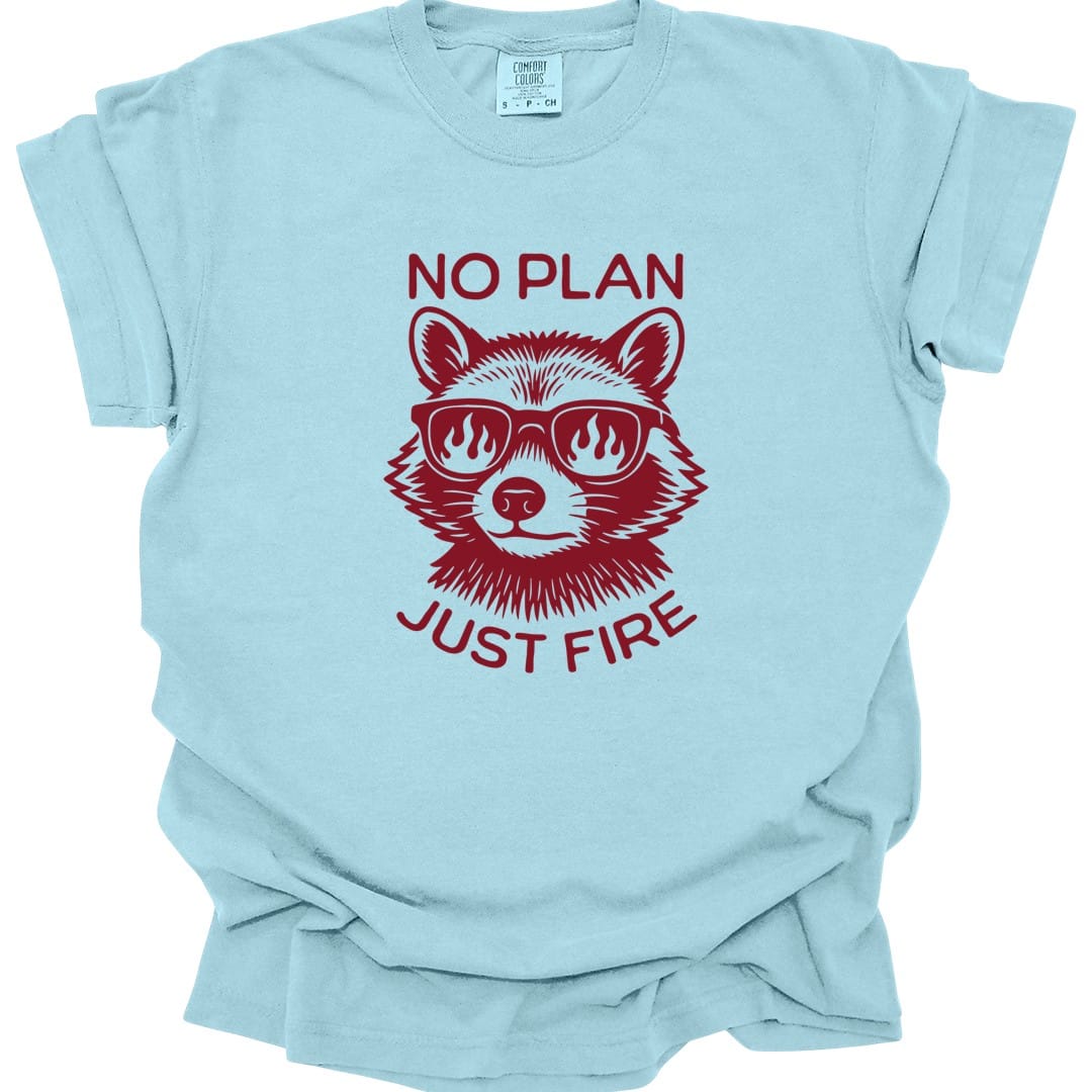 The same No Plan Just Fire raccoon design, on a chambray t-shirt.