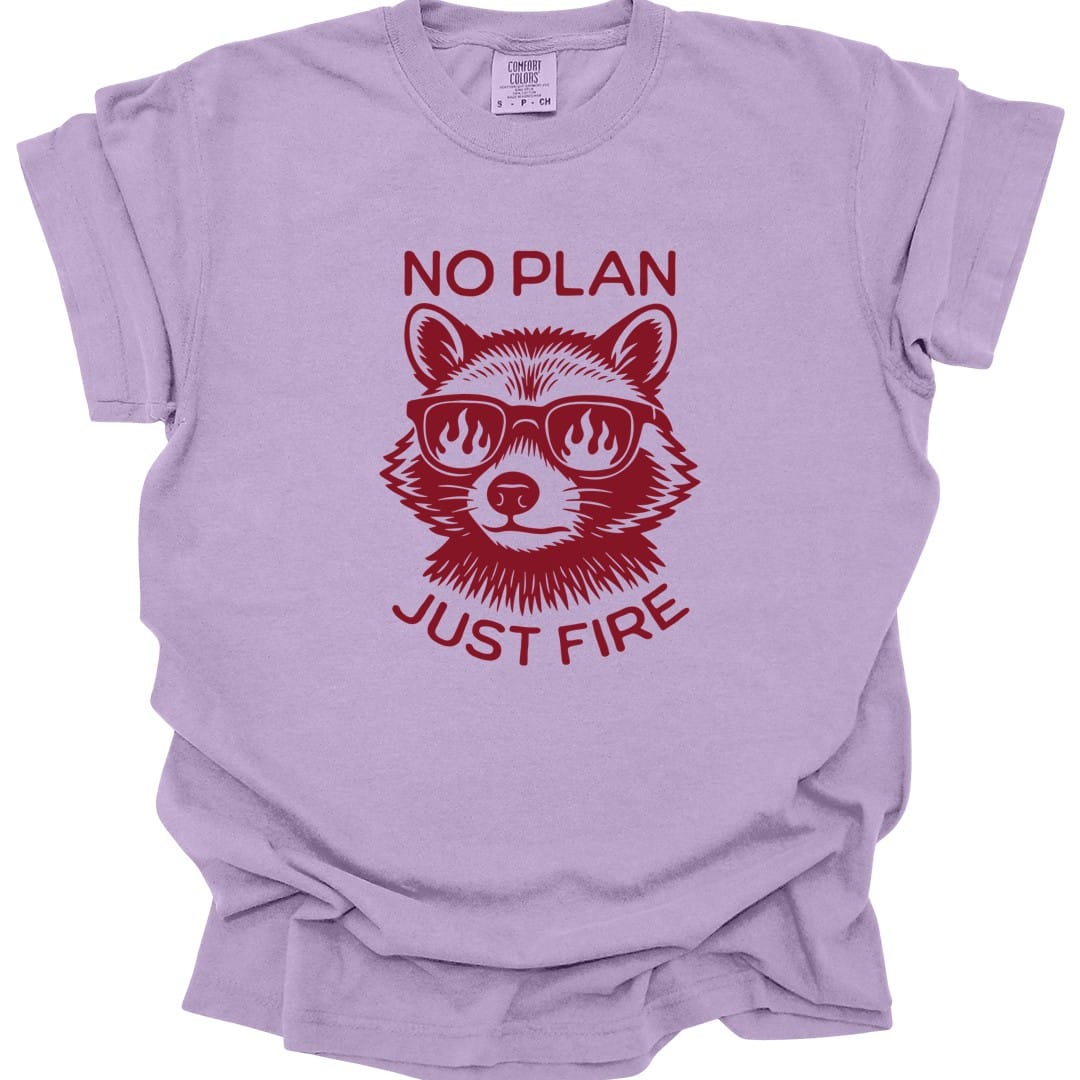 The same No Plan Just Fire raccoon design, on an orchid t-shirt.