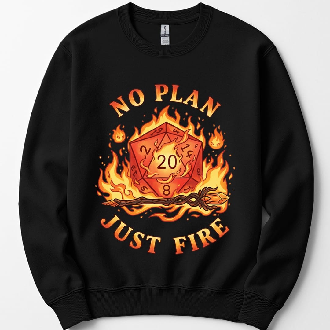 Black sweatshirt. Reads "No plan" curving across the top and "Just fire" across the bottom in orange capitals. Between them a burning twenty-sided die showing 20 sits wrapped in flames, with a lit torch lying beneath it. Warm oranges, reds and yellows.