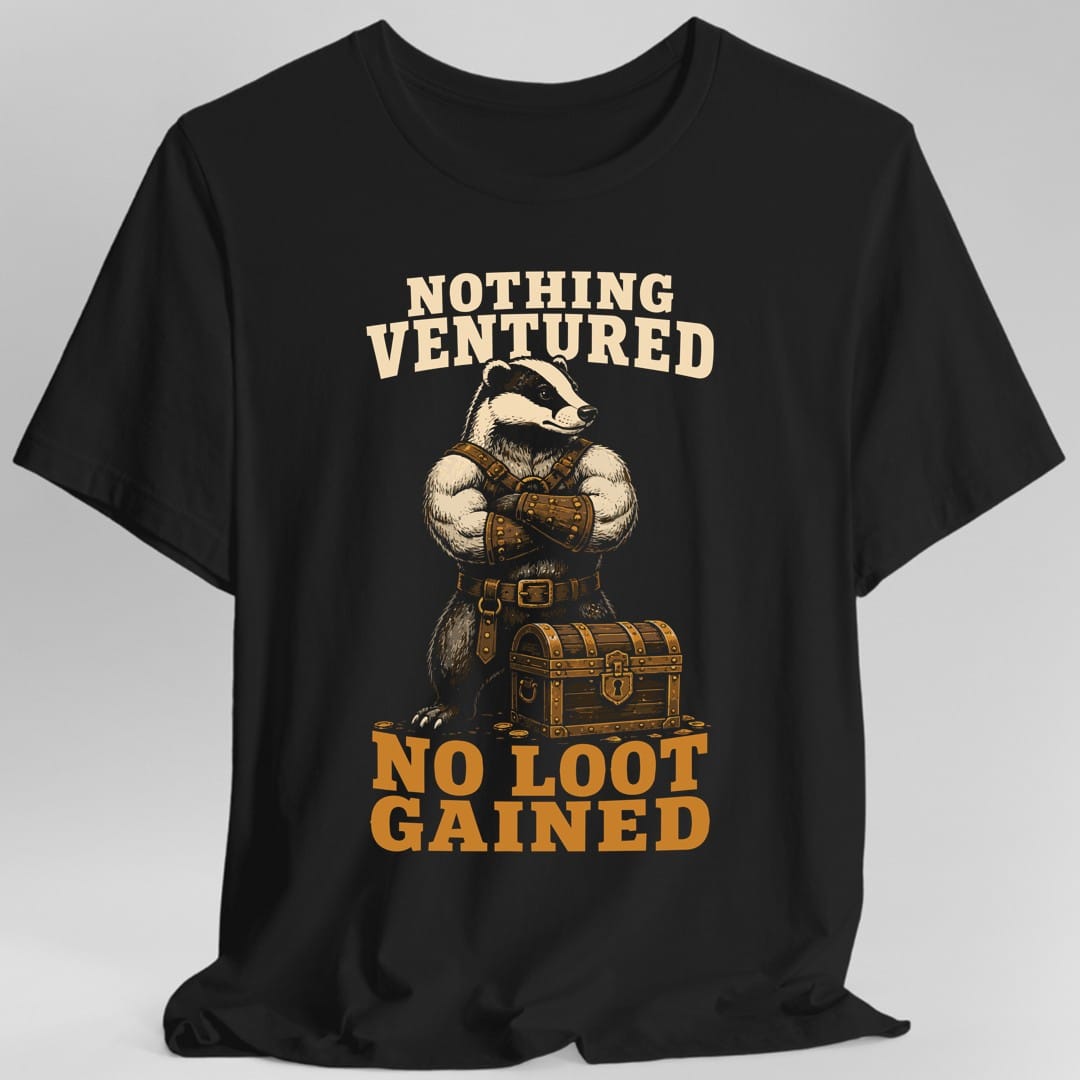 Black t-shirt. The design reads "NOTHING VENTURED" in two cream lines across the top and "NO LOOT GAINED" in two big gold lines at the bottom. Between them stands a badger in a studded leather harness and belt, arms folded across its chest, looking straight ahead. A banded wooden treasure chest with a keyhole sits at its feet with a few loose coins around it. Drawn in cream, brown and gold.