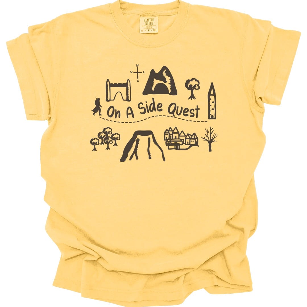 The same Side Quest doodle map design, on a butter t-shirt.