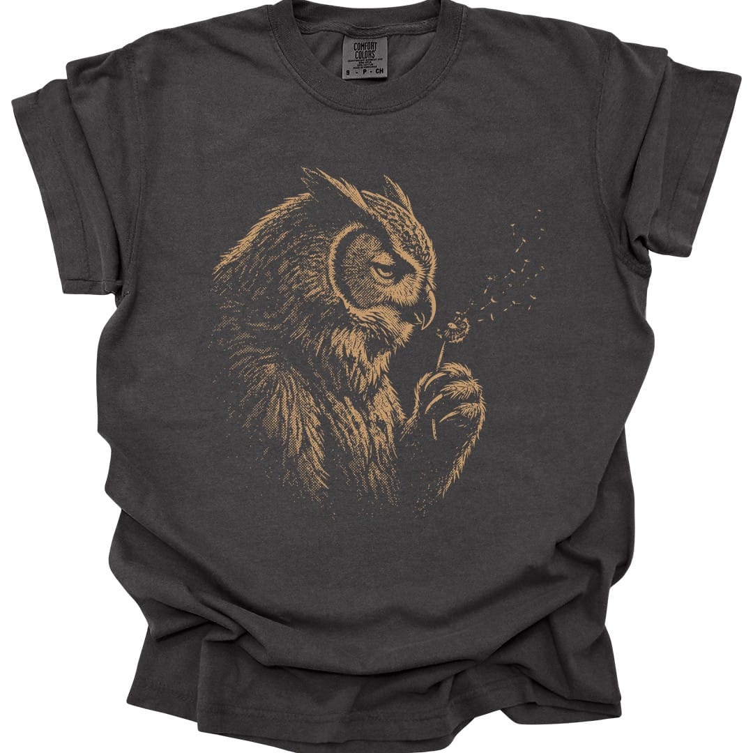 The same Owlbear Dandelion design, on a pepper t-shirt.
