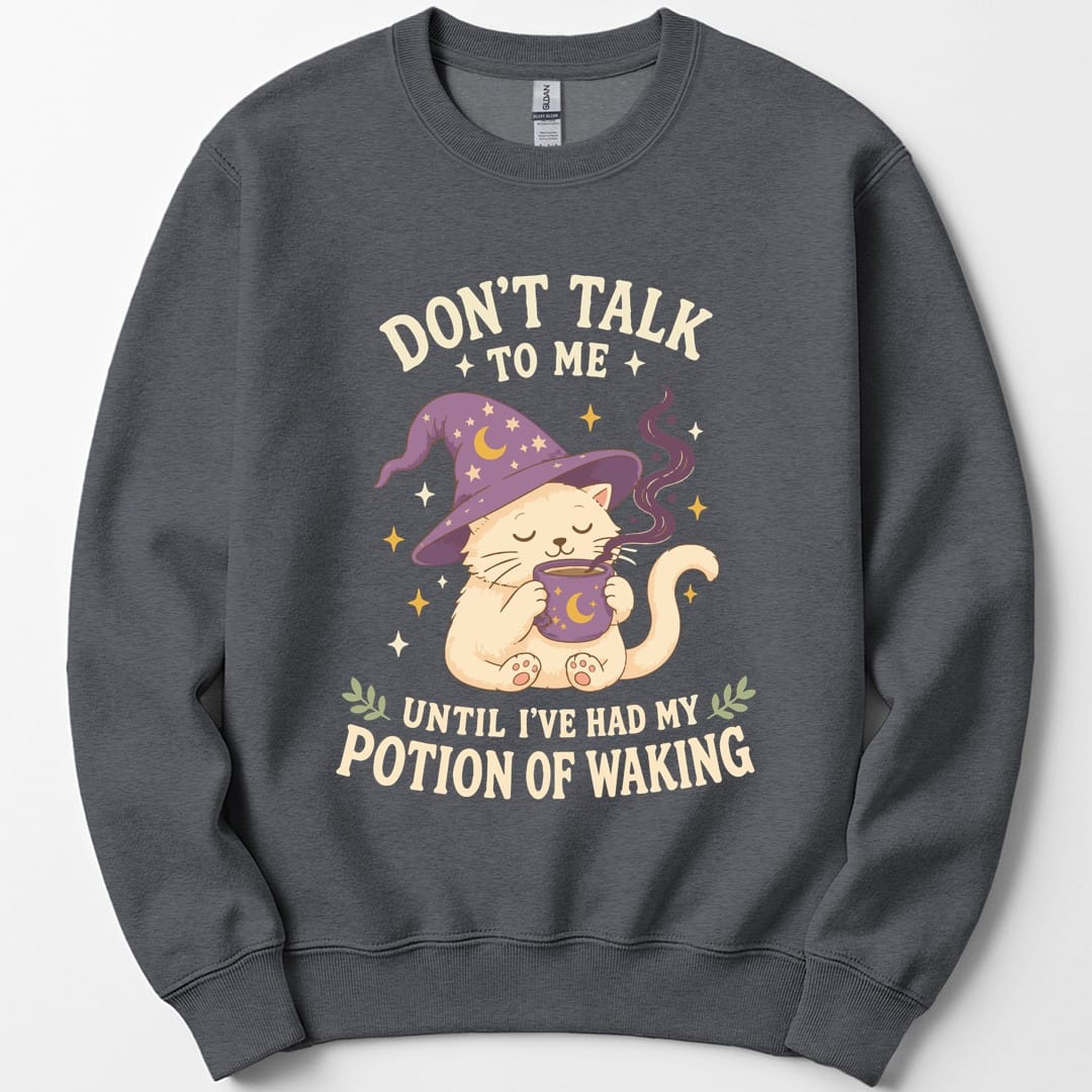 The same Potion Of Waking cat design, on a dark heather sweatshirt.