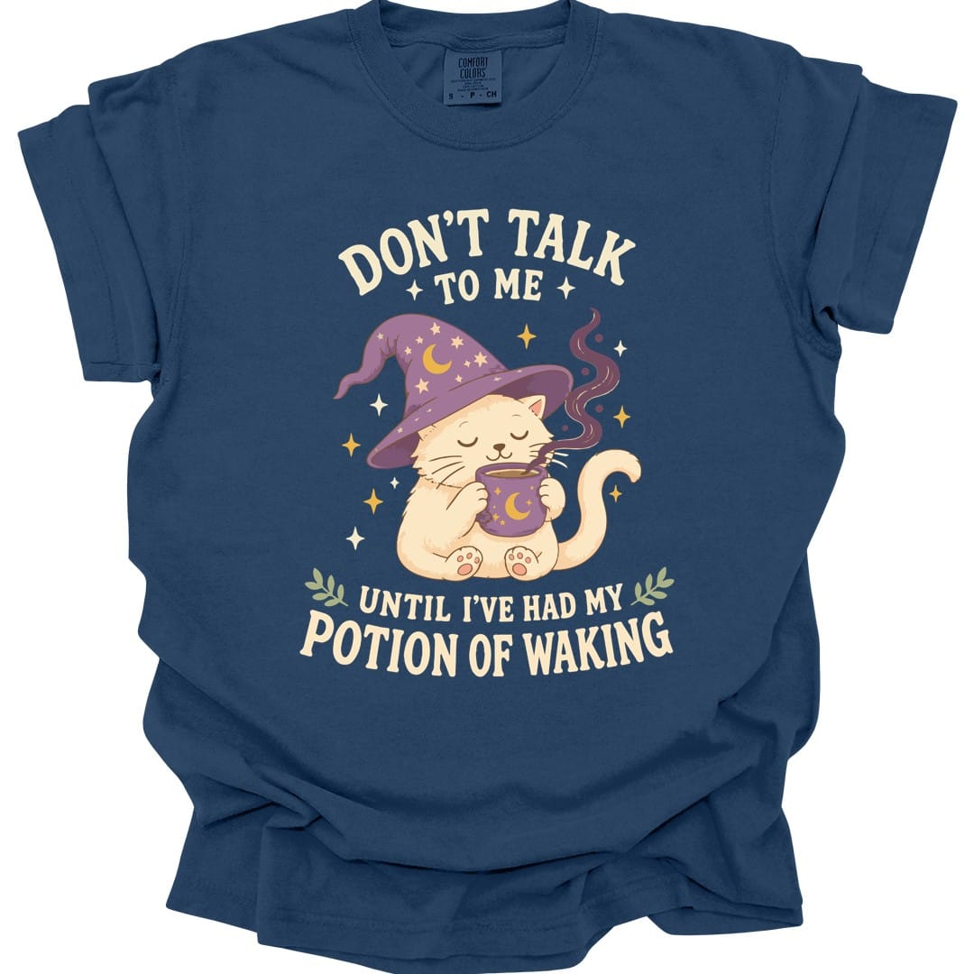 The same Potion Of Waking cat design, on a true navy t-shirt.