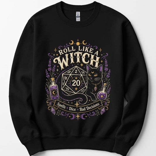 Black sweatshirt. Reads "Roll like a" curving across the top and "Witch" in large cream capitals beneath. Below sits a large twenty-sided die showing 20 with a black cat beside it, two potion bottles either side and a banner underneath reading "Spells, dice, bad decisions".