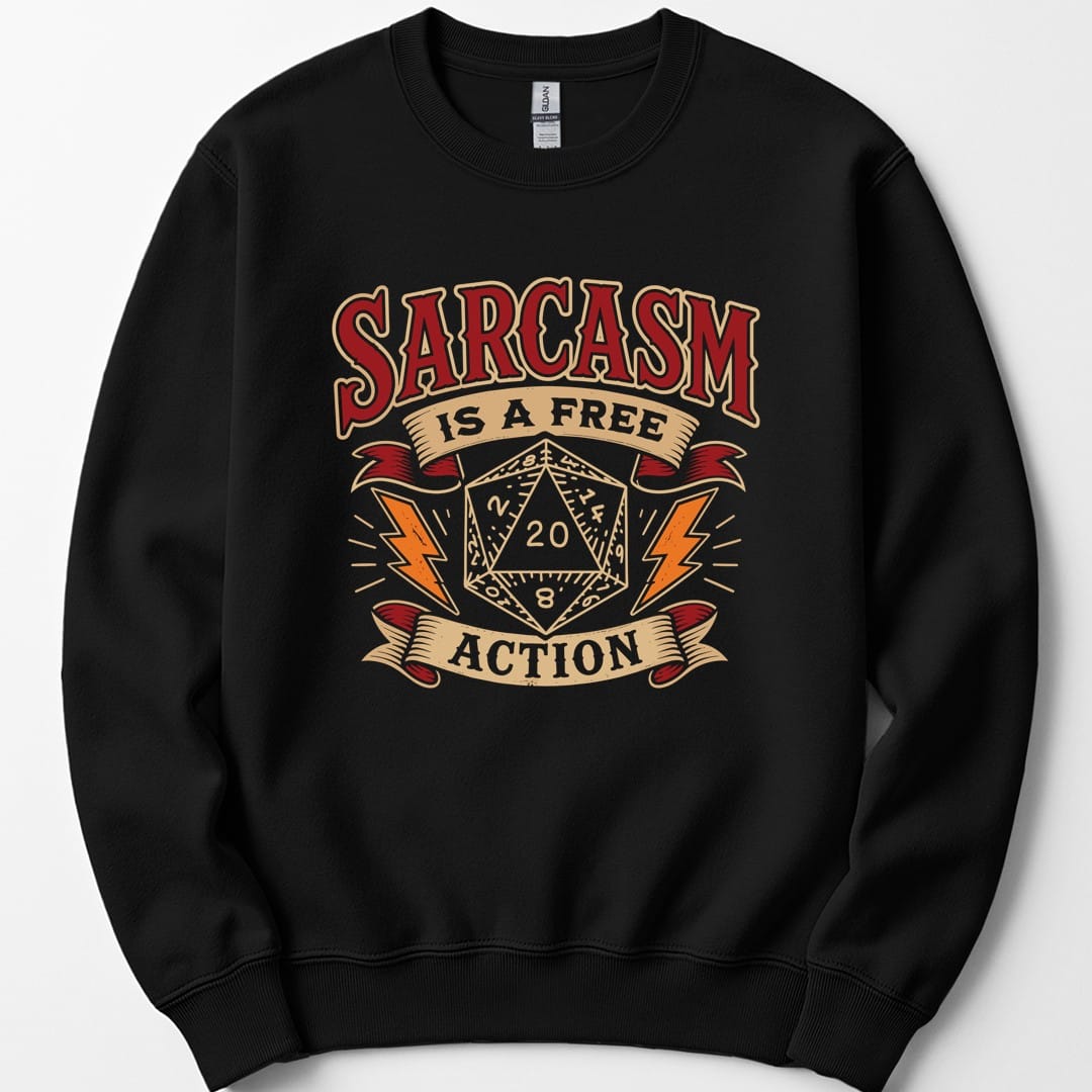 Black sweatshirt. Reads "Sarcasm" across the top in dark red capitals, "Is a free" on a cream banner beneath, and "Action" on another banner at the bottom. Between them a cream twenty-sided die showing 20 sits with an orange lightning bolt on each side.