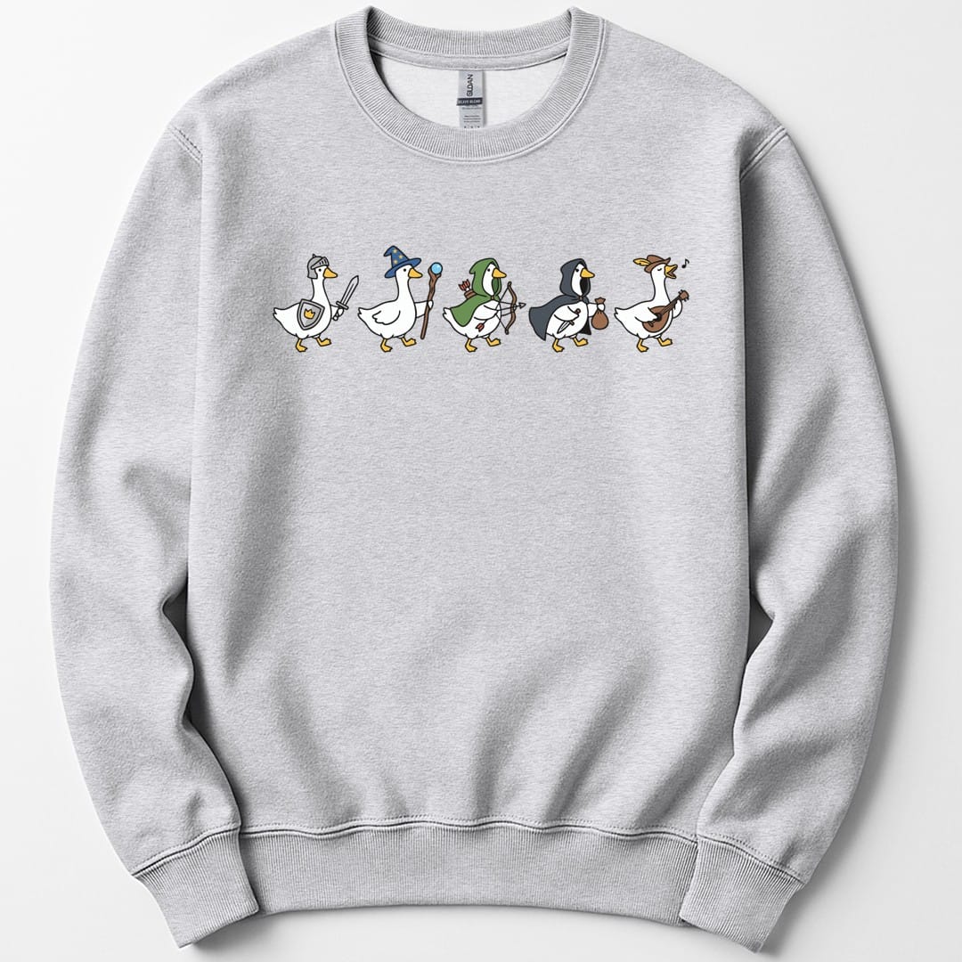 Ash sweatshirt. Five white cartoon geese walk in a row across the top of the design, each kitted out as an adventurer: a knight in a steel helm with sword and shield, a wizard in a starry blue hat with a staff, a ranger in a green hood with a bow and quiver, a rogue in a dark cloak with a dagger and a coin purse, and a bard in a feathered hat playing a lute. Simple clean cartoon style. No words at all.