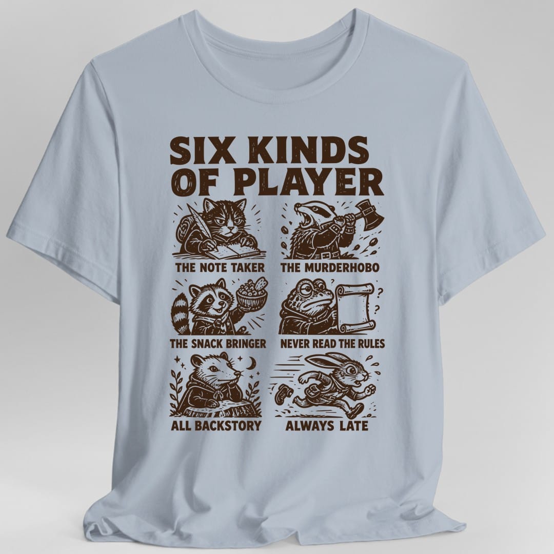The same Six Kinds Of Player grid design, on a light blue t-shirt.