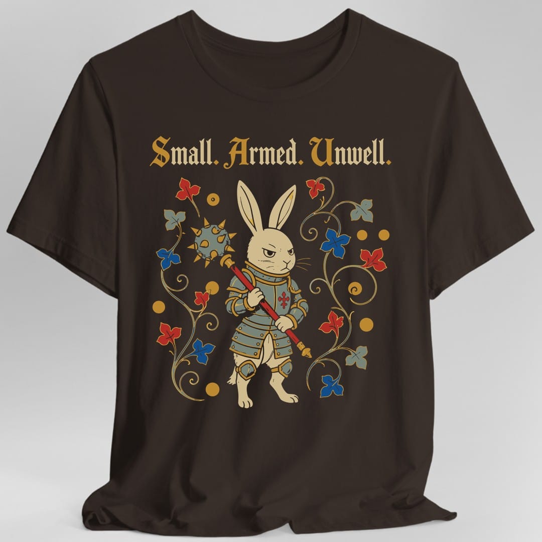 The same Small Armed Unwell rabbit design, on a dark chocolate t-shirt.