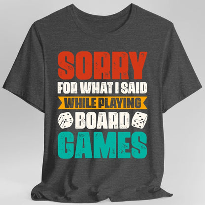 The same Sorry For What I Said board games design, on a dark heather t-shirt.