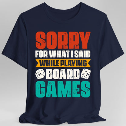The same Sorry For What I Said board games design, on a navy t-shirt.