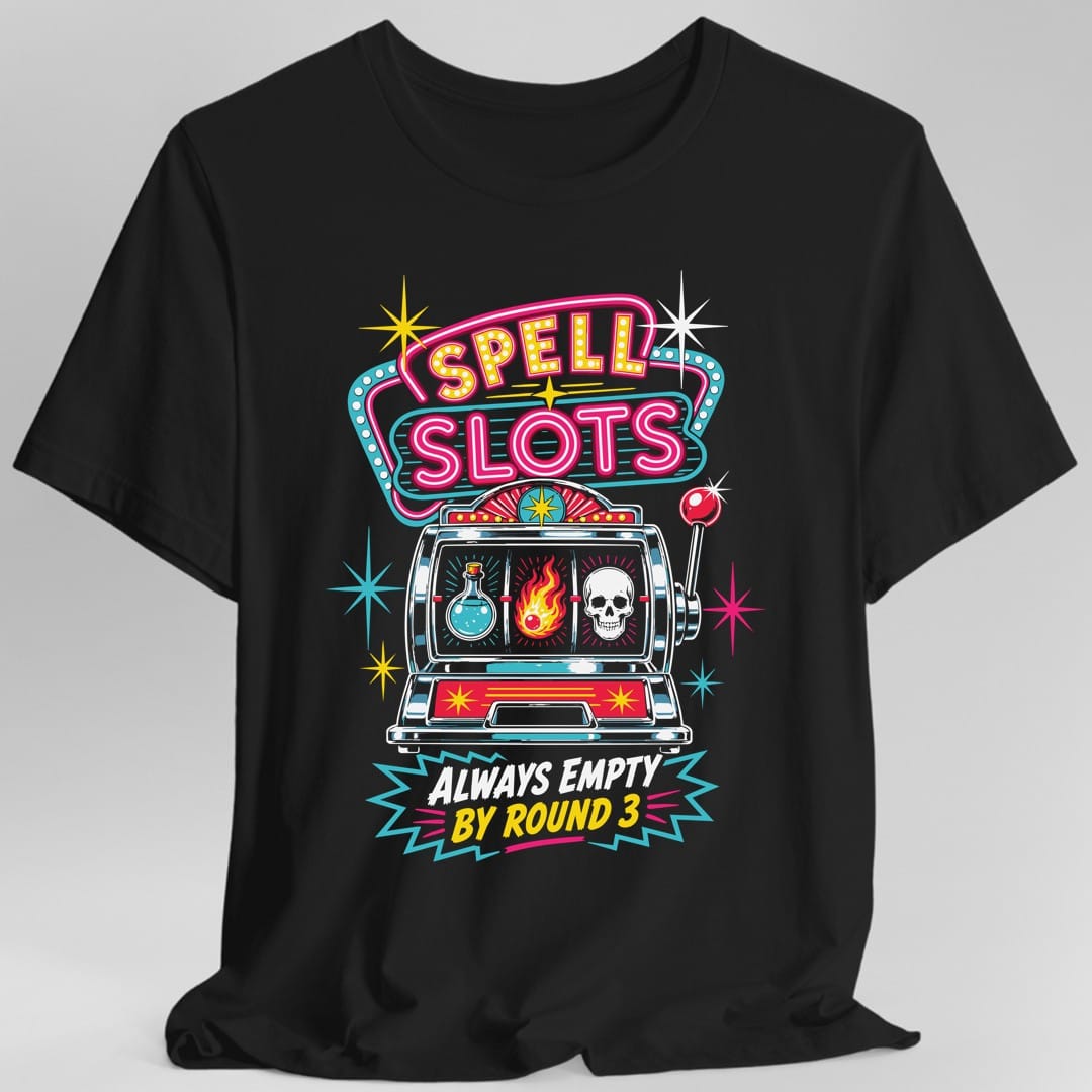 Black t-shirt. A retro neon casino sign reads "Spell Slots" in yellow bulb lettering and hot pink tube script, inside a teal and pink outline. Below it a vintage slot machine with a chrome body shows three windows: a blue potion bottle, a flaming fireball and a white skull, with a red ball-topped lever on the side. Starbursts scatter around it and "Always Empty By Round 3" sits underneath in white and yellow.