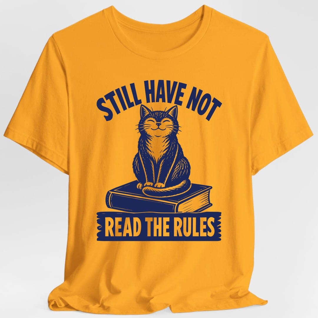 The same Still Have Not Read The Rules cat design, on a gold t-shirt.