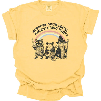 The same Support Your Local Adventuring Party design, on a butter t-shirt.